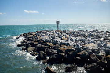Sea wall or breakwater built of natural rocks