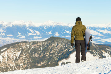 Snowboarder at the top of a mountain
