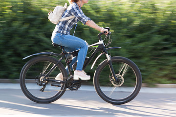 girl is riding a bicycle