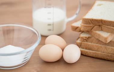 All Ingredients for french toast preparation eggs milk bread and sugar