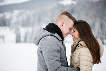 Closeness of romantic smiling teenage couple