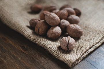 Walnuts on an old wooden table. Natural healthy food. Rustic