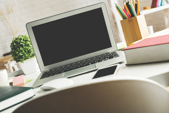 Modern desktop with laptop screen
