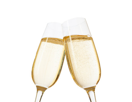 Close-up of two glasses of Champagne clinking together.  Isolated on white  background. Focus on near glass.