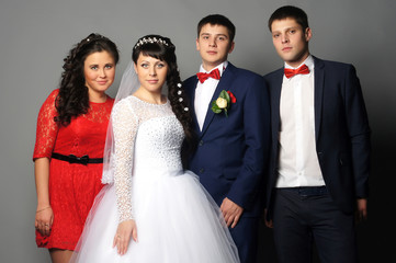 Fototapeta premium beautiful bride with her girlfriends posing at studio
