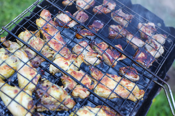 Chicken legs on grill.