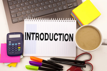 Introduction text in the office with surroundings such as laptop, marker, pen, stationery, coffee. Business concept for starting Firs Experience white background with copy space