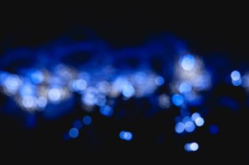 sparkling abstract bokeh background blue color with glitter circles