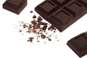 Broken chocolate bar isolated on white