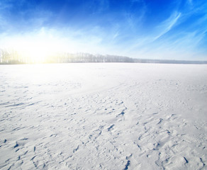  Snowcovered fields on blue sky