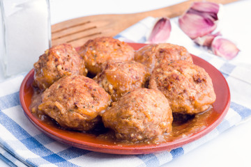 Stewed meatballs in sauce
