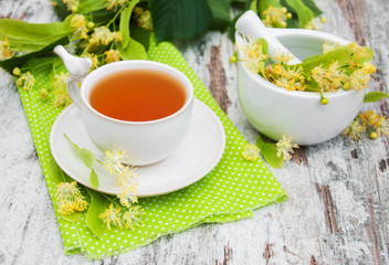 cup of herbal tea with linden flowers