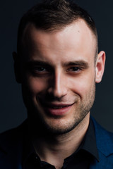 Obraz premium Close-up portrait of a attractive handsome man. Good nice guy looks at the frame.