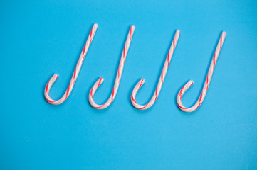 Minimal Candy canes on blue background