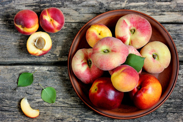 Colorful fruits apricot, nectarine and peach on a wooden table © san_ta