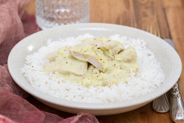 turkey curry with boiled rice on plate