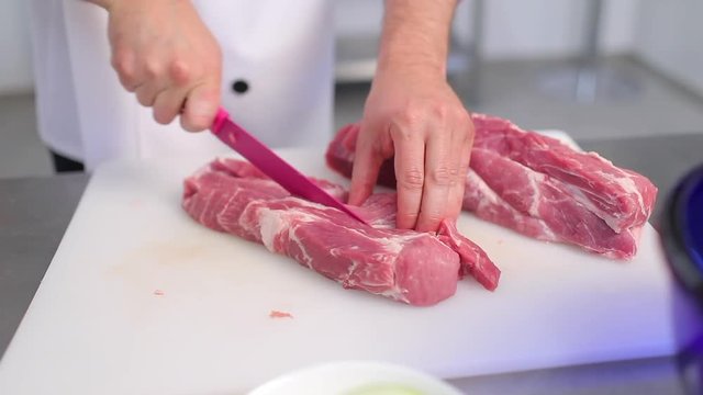 cook cuts pork