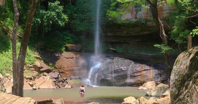 Woman at "Salto Suizo" the highest waterfall in Paraguay near Villarrica and the Colonia Independencia.