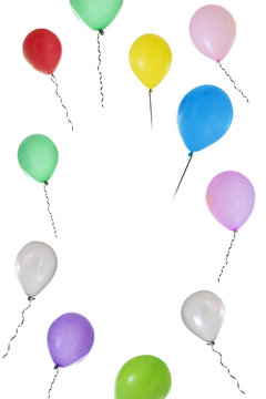 Vertical image of Balloons of different colours flying on white background with copy text in the middle