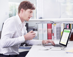 Young businessman with coffee