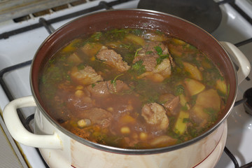 cooking of Oriental lamb soup with dried fruits, called Bozbash