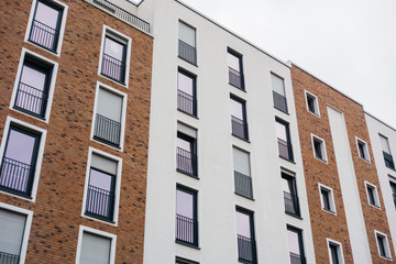 brown and white facaded brick apartment building