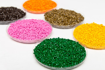 Plastic pellets .Polymeric dye в granules. The recycling of plastic. Granular colored plastic...