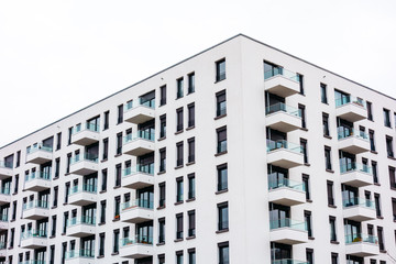 big white building with square balcony