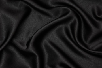 Black fabric texture background. Smooth elegant black silk can use as wedding background.