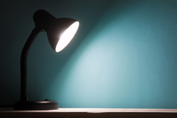 Lamp night light in a dark background. Vintage effect style picture.