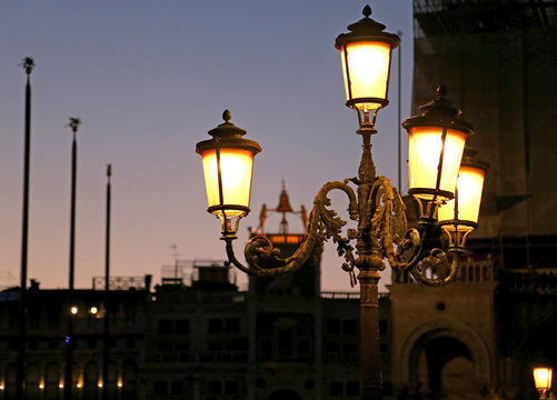 Fototapeta Venice Italy by night with the historic street lamp and the bell