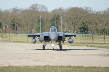 Military jet fighter pilot taking off from military airfield, air warfare