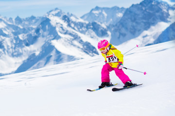 Ski and snow fun. Kids skiing. Child winter sport.