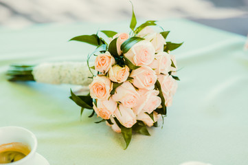 Wedding bouquet of roses on the table
