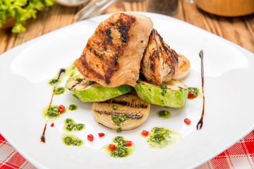 Beef steak with grilled vegetables and seasoning on serving board block