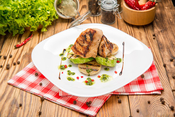 Beef steak with grilled vegetables and seasoning on serving board block