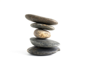 Stack of stones balancing isolated on white background