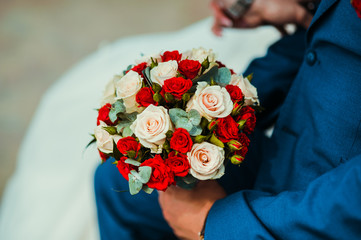 The bride with a bouquet of roses