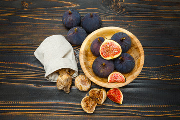 Fresh and dried Fig isolated on wooden background