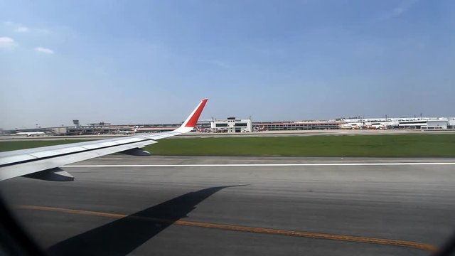 Plane taking off from airport, View through an airplane window