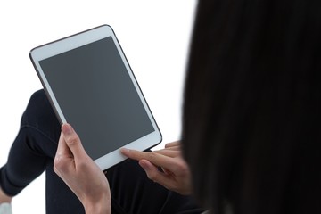 Female executive using digital tablet