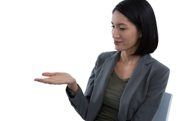 Businesswoman pretending to hold invisible object