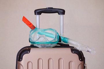 snorkel mask on the suitcase for sea travel