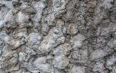 Fototapeta premium Texture of pieces of frozen cement on the foundation