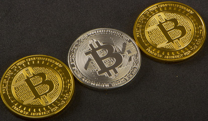 Coins bitcoin on black background closeup
