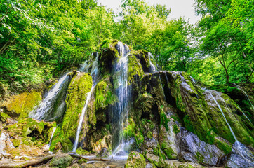 Beautiful background with the famous Beusnita waterfall from Romanian National Park in spring season, Europe