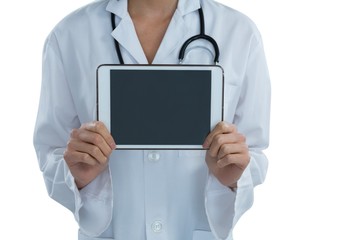 Mid section female doctor holding digital tablet