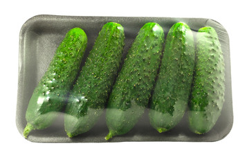 The packing of fresh cucumbers without label isolated on a white background with clipping path.