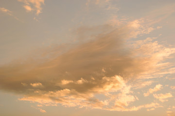 Fototapeta na wymiar Horizontal photo of a beautiful sunset sky rich in orange clouds and warm tones
