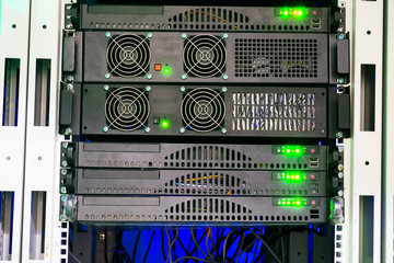 The front panel of the server on which shines a bright green display